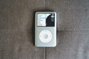 an ipod sitting on top of a couch
